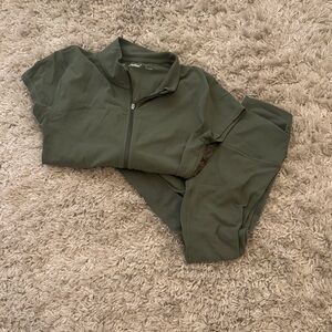 Olive Green ARITZIA TNA ACTION SET top is large leggings are small